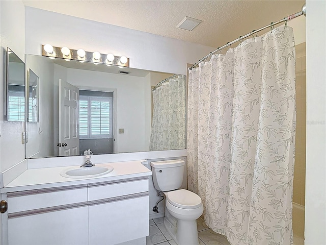 full bath featuring toilet, a textured ceiling, visible vents, tile patterned flooring, and vanity