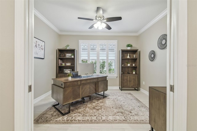 office area with a ceiling fan, ornamental molding, light wood finished floors, and baseboards