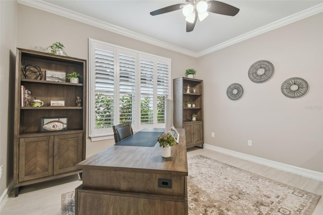 office area with a ceiling fan, baseboards, ornamental molding, and light wood finished floors
