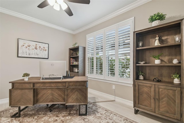 home office with a ceiling fan, crown molding, and baseboards