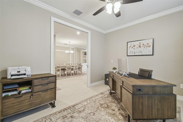 home office with a ceiling fan, a chandelier, crown molding, and baseboards