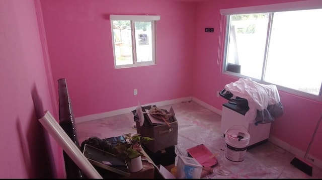 12425 Ridge Rd, Largo, FL 33778 - empty room featuring baseboards and a wealth of natural light