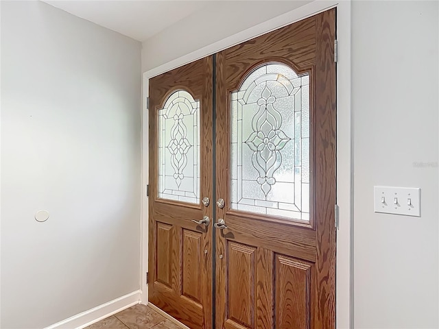 9679 W Pimpernel Ln, Crystal River, FL 34429 - foyer with a wealth of natural light, baseboards, and french doors