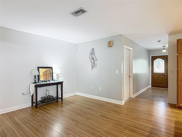 9679 W Pimpernel Ln, Crystal River, FL 34429 - interior space with baseboards, light wood-style floors, and visible vents