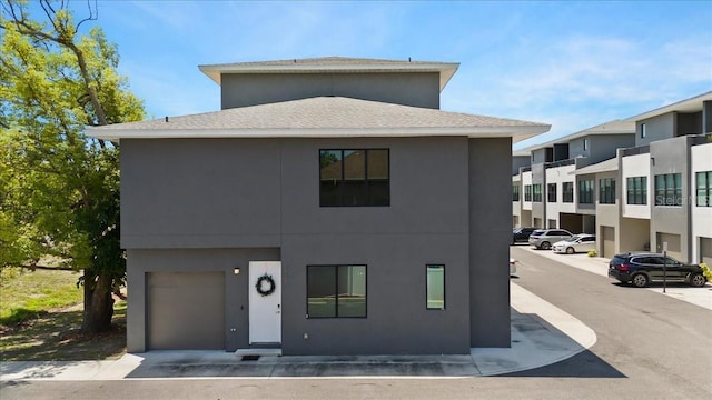 8723 Palm Ranches Pl, Tampa, FL 33614 - view of front of house with roof with shingles and stucco siding