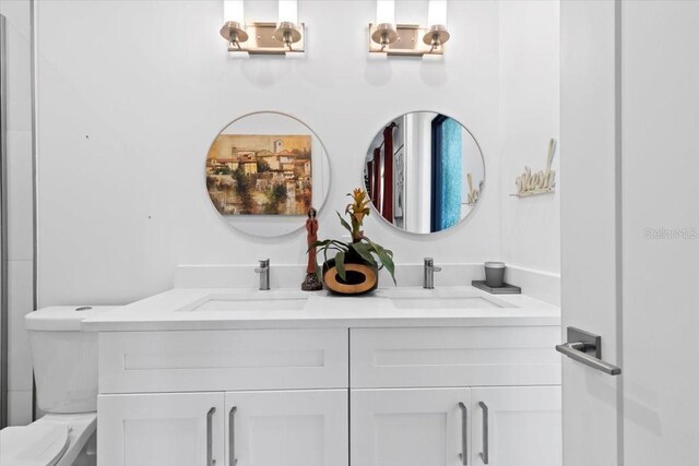 8723 Palm Ranches Pl, Tampa, FL 33614 - bathroom with double vanity and toilet