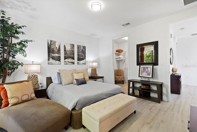 8723 Palm Ranches Pl, Tampa, FL 33614 - bedroom with light wood-style flooring and a spacious closet
