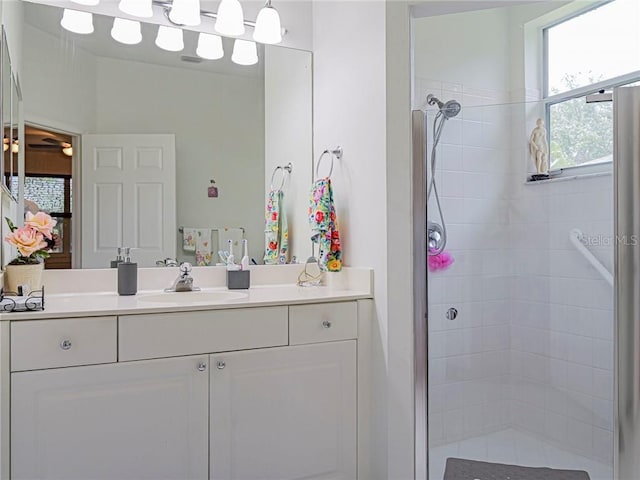 bathroom featuring vanity and a shower stall