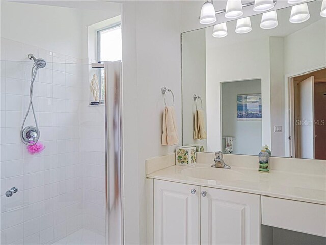 full bath with vanity and a stall shower