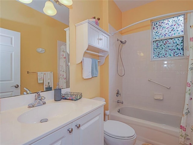 full bath with shower / bath combination with curtain, toilet, and vanity