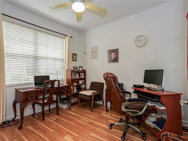office with ceiling fan, light wood-style flooring, and baseboards