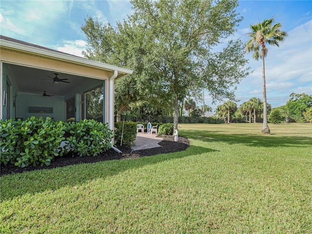 view of yard with ceiling fan