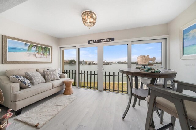868 Bayway Blvd Unit 206, Clearwater Beach, FL 33767 - sunroom with a water view and a chandelier