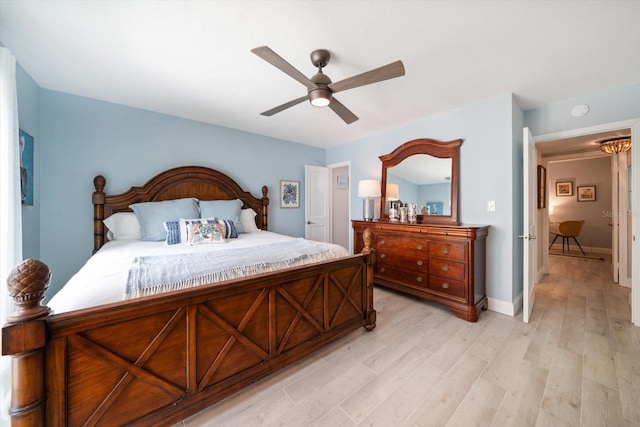 868 Bayway Blvd Unit 206, Clearwater Beach, FL 33767 - bedroom featuring light wood-style floors, ceiling fan, and baseboards