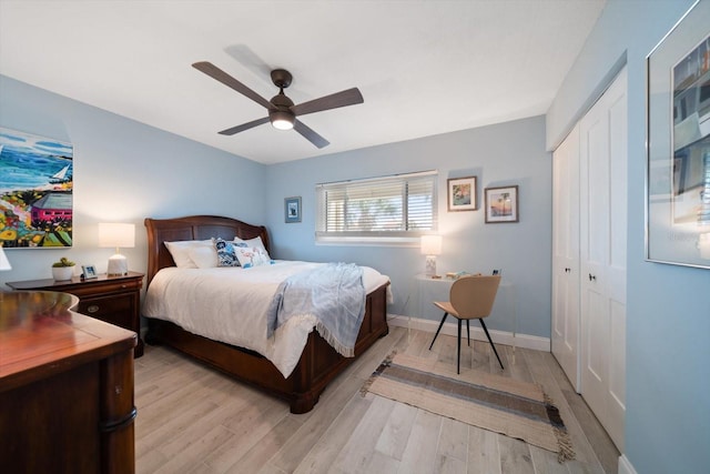 868 Bayway Blvd Unit 206, Clearwater Beach, FL 33767 - bedroom with a closet, light wood-style floors, ceiling fan, and baseboards