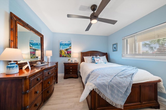 868 Bayway Blvd Unit 206, Clearwater Beach, FL 33767 - bedroom featuring light wood-type flooring, baseboards, and a ceiling fan