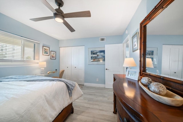 868 Bayway Blvd Unit 206, Clearwater Beach, FL 33767 - bedroom featuring light wood finished floors, a closet, baseboards, and a ceiling fan
