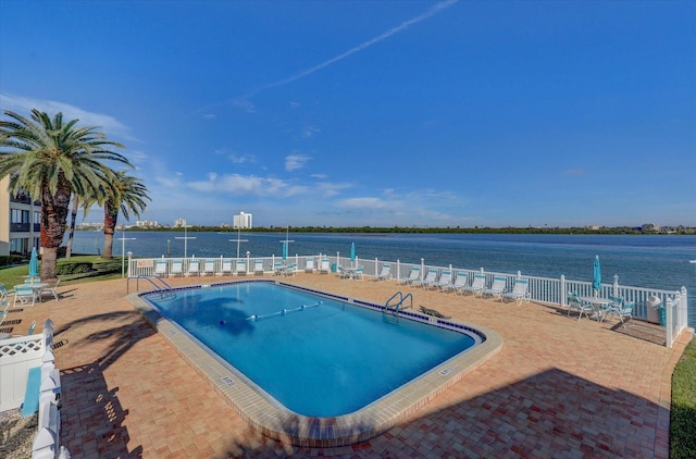 868 Bayway Blvd Unit 206, Clearwater Beach, FL 33767 - community pool featuring fence, a water view, and a patio area