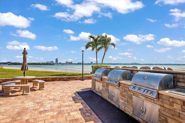 868 Bayway Blvd Unit 206, Clearwater Beach, FL 33767 - view of patio / terrace featuring area for grilling and a water view