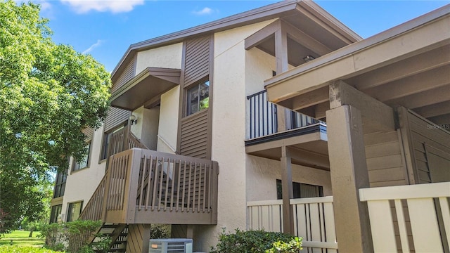 12804 Wedgewood Way Unit C, Hudson, FL 34667 - view of home's exterior with stucco siding and a balcony