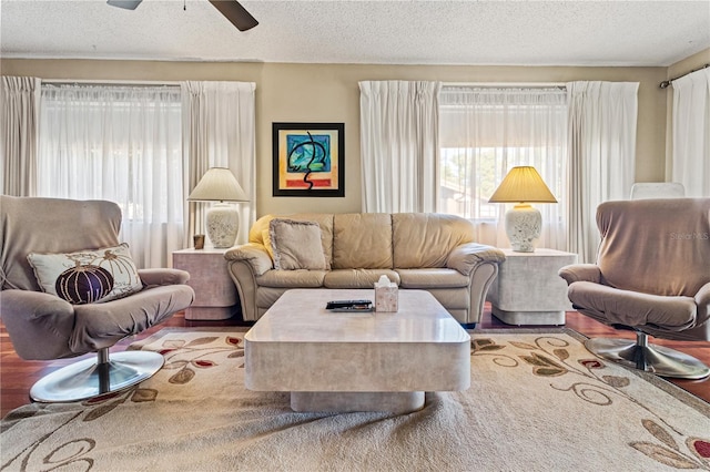 12804 Wedgewood Way Unit C, Hudson, FL 34667 - living area with a textured ceiling, ceiling fan, and wood finished floors