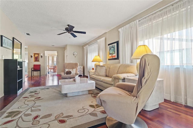 12804 Wedgewood Way Unit C, Hudson, FL 34667 - living room with wood finished floors, a textured ceiling, and a ceiling fan