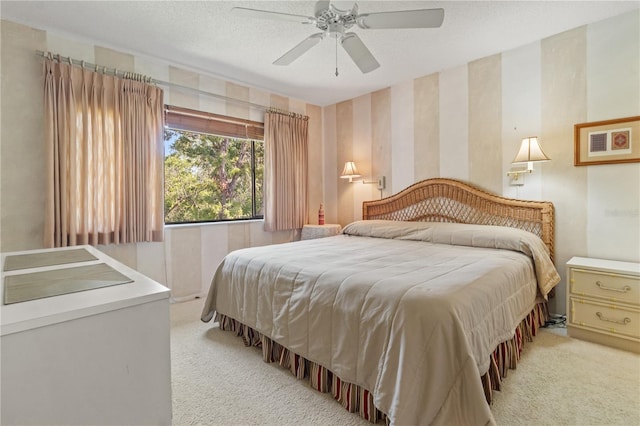 12804 Wedgewood Way Unit C, Hudson, FL 34667 - bedroom featuring light carpet, wallpapered walls, and ceiling fan
