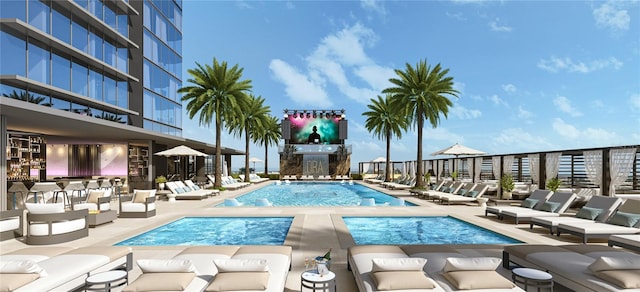 pool featuring a hot tub and a patio