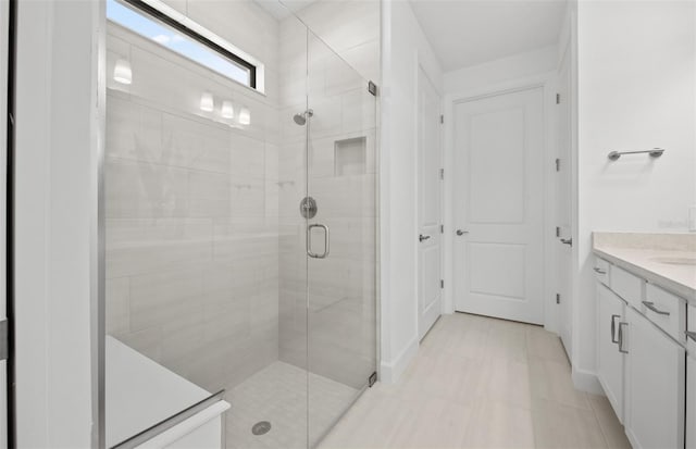 full bath featuring a stall shower and vanity