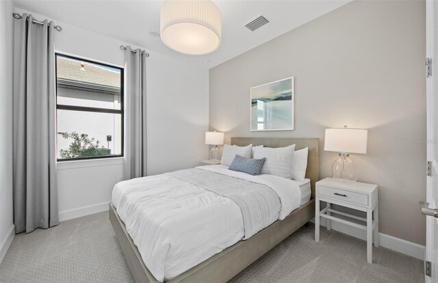 carpeted bedroom featuring baseboards
