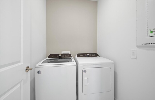 washroom with independent washer and dryer