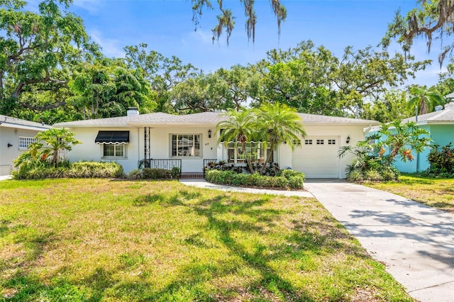 ranch-style home with driveway, covered porch, a garage, stucco siding, and a front lawn