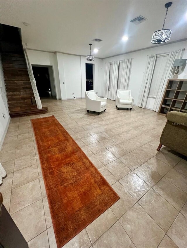 1030 Marcello Blvd, Kissimmee, FL 34746 - living area with light tile patterned floors, baseboards, and visible vents