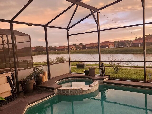 1030 Marcello Blvd, Kissimmee, FL 34746 - view of pool featuring a lanai and a water view