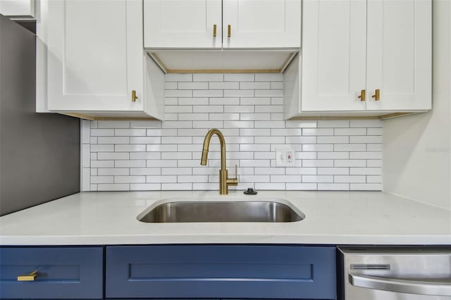 3535 16th St N, Saint Petersburg, FL 33704 - kitchen with a sink, stainless steel dishwasher, white cabinetry, and backsplash