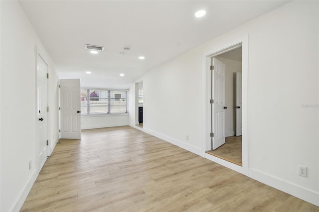 3535 16th St N, Saint Petersburg, FL 33704 - spare room featuring light wood-style floors, baseboards, recessed lighting, and a fireplace