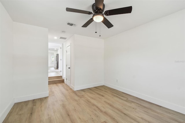 3535 16th St N, Saint Petersburg, FL 33704 - spare room featuring light wood finished floors, baseboards, a ceiling fan, and recessed lighting
