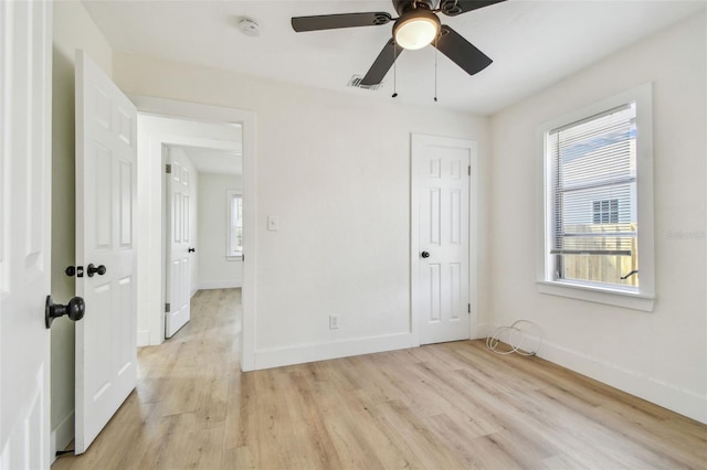 3535 16th St N, Saint Petersburg, FL 33704 - unfurnished bedroom with baseboards, light wood-type flooring, a ceiling fan, and a closet