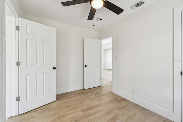 3535 16th St N, Saint Petersburg, FL 33704 - unfurnished bedroom featuring baseboards, light wood finished floors, and ceiling fan