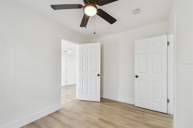 3535 16th St N, Saint Petersburg, FL 33704 - unfurnished bedroom with light wood finished floors, baseboards, and ceiling fan
