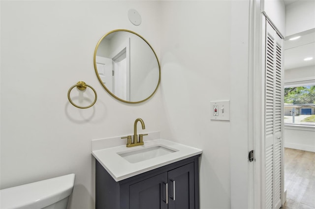 3535 16th St N, Saint Petersburg, FL 33704 - bathroom featuring toilet, vanity, and wood finished floors