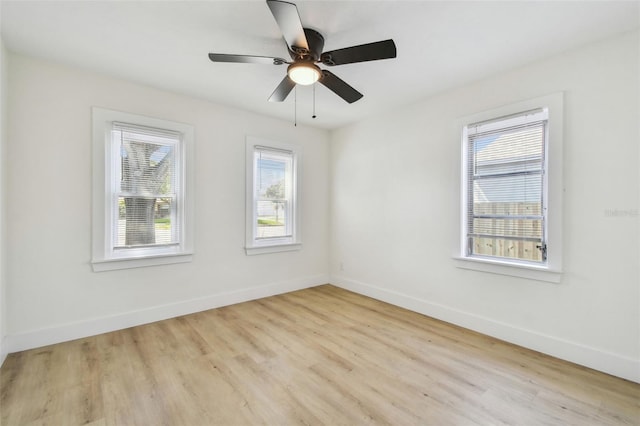 3535 16th St N, Saint Petersburg, FL 33704 - empty room with wood finished floors, baseboards, and ceiling fan