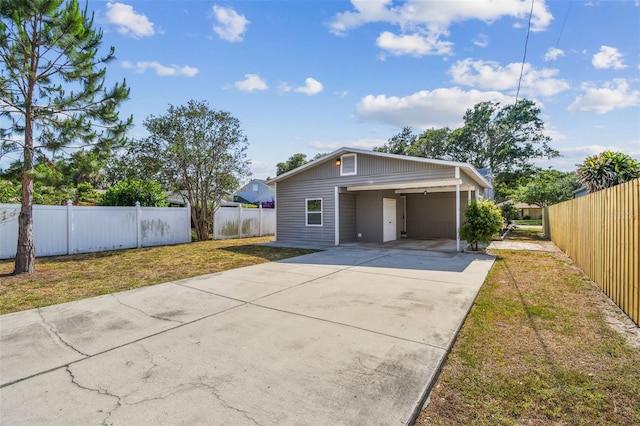 3535 16th St N, Saint Petersburg, FL 33704 - view of front facade with driveway and a carport