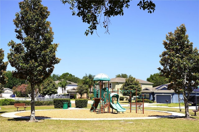 community playground featuring a lawn