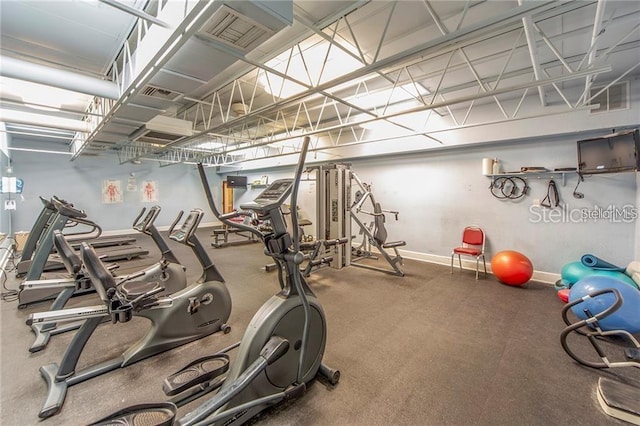 gym with baseboards and visible vents
