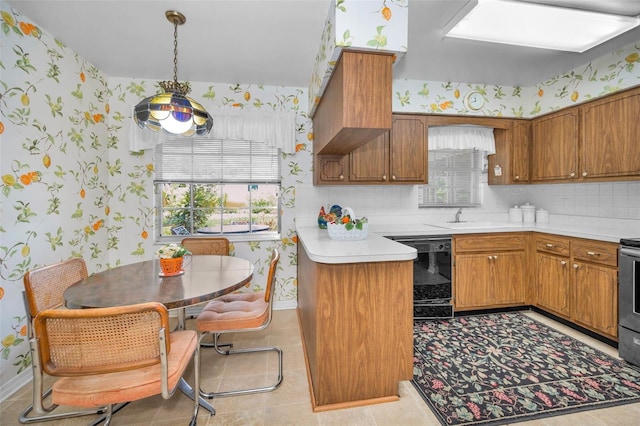 kitchen with dishwasher, wallpapered walls, brown cabinets, light countertops, and baseboards