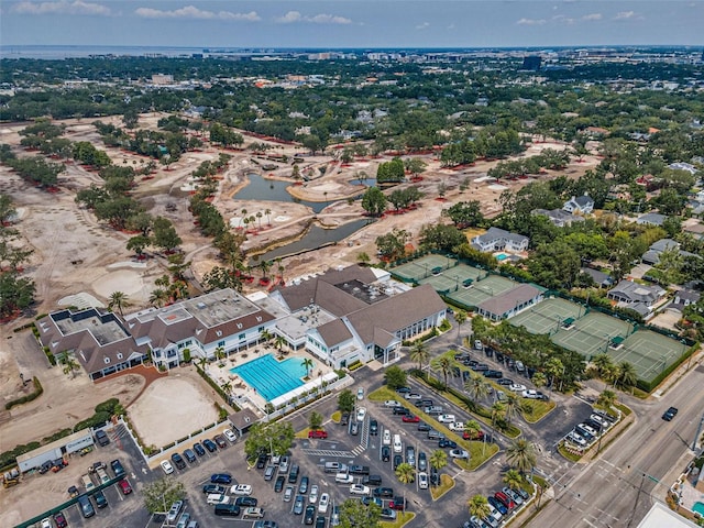aerial view of property's location with a pool area