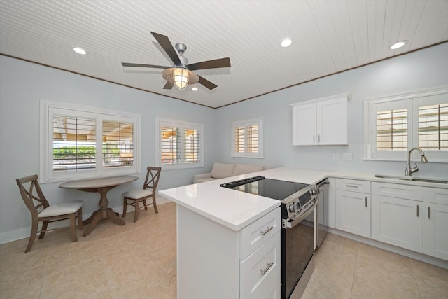 kitchen with a sink, recessed lighting, stainless steel range with electric stovetop, and dishwasher
