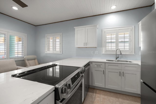 kitchen with light tile patterned floors, stainless steel appliances, recessed lighting, and a sink