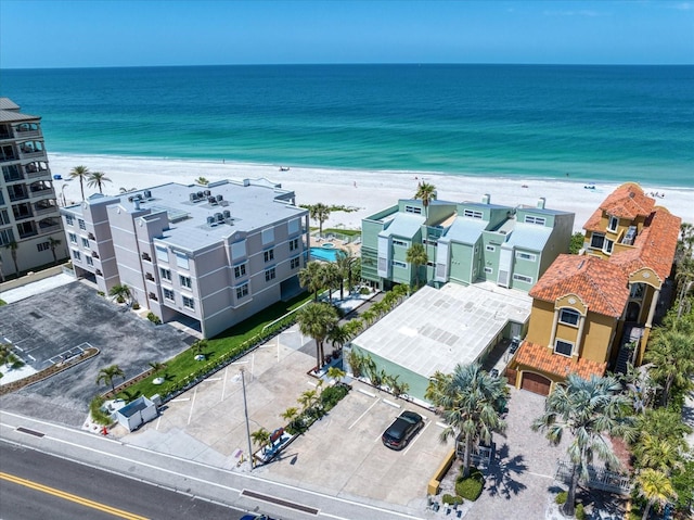 birds eye view of property featuring a view of the beach and a water view